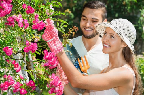 Operative inspecting a garden before mowing